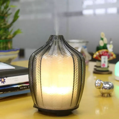 Harga yang pantas Ultrasonik Aroma Diffusers Nebulizer yang tenang Desain unik komersial Mesin wangi minyak esensial portabel dengan cahaya hangat on line
